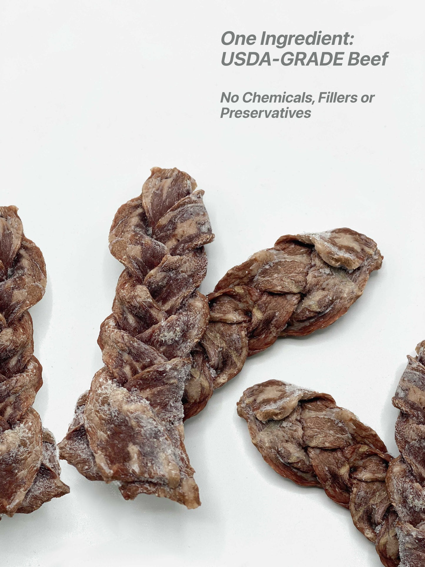 Up close photo of the USDA-Grade beef braids of the Moo Moo Beef Jerky dog treat